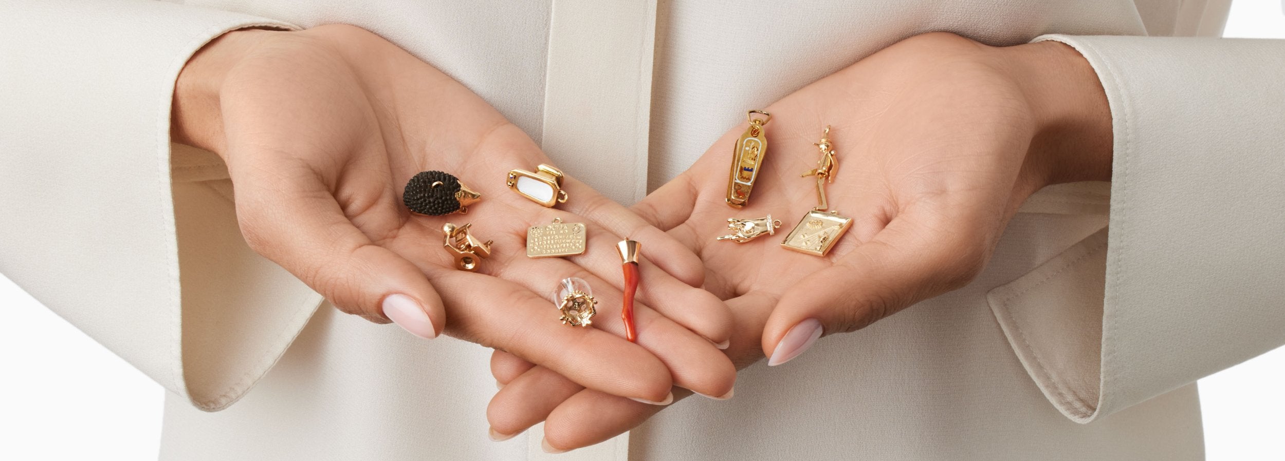 handful of unique gold charms